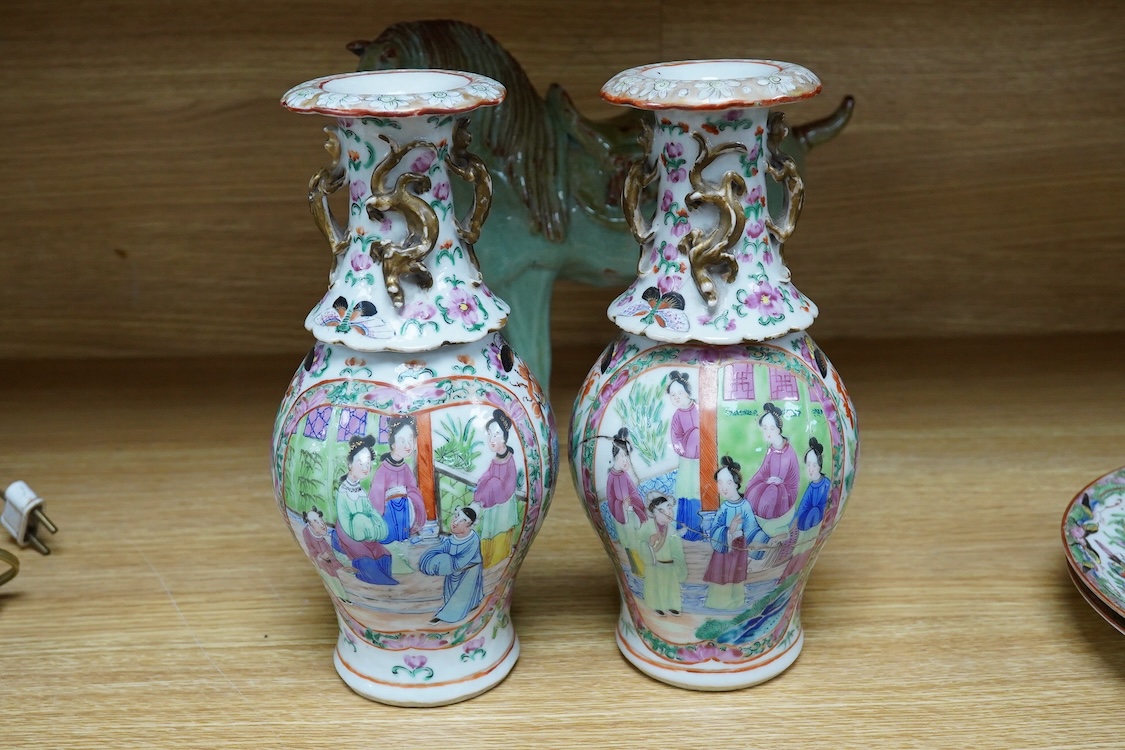 A pair of Chinese famille rose vases, two Canton plates and a green glazed horse, largest 29cm wide